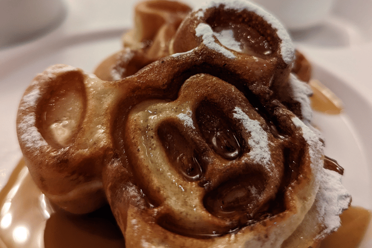 Enjoying the Mickey Waffles onboard the Disney Magic Cruise Ship